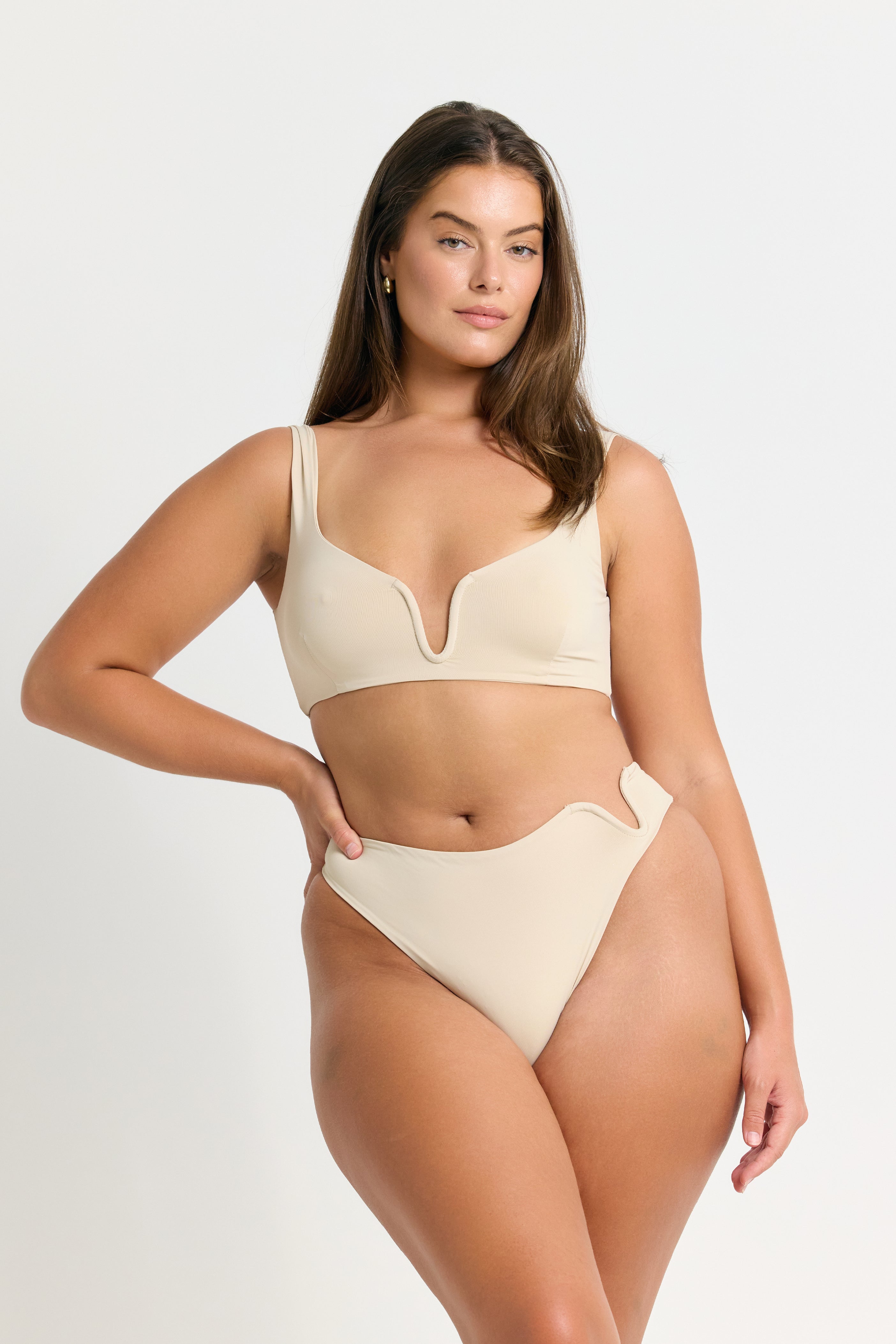 WOMAN WEARING A COCONUT BIKINI ON WHITE BACKGROUND