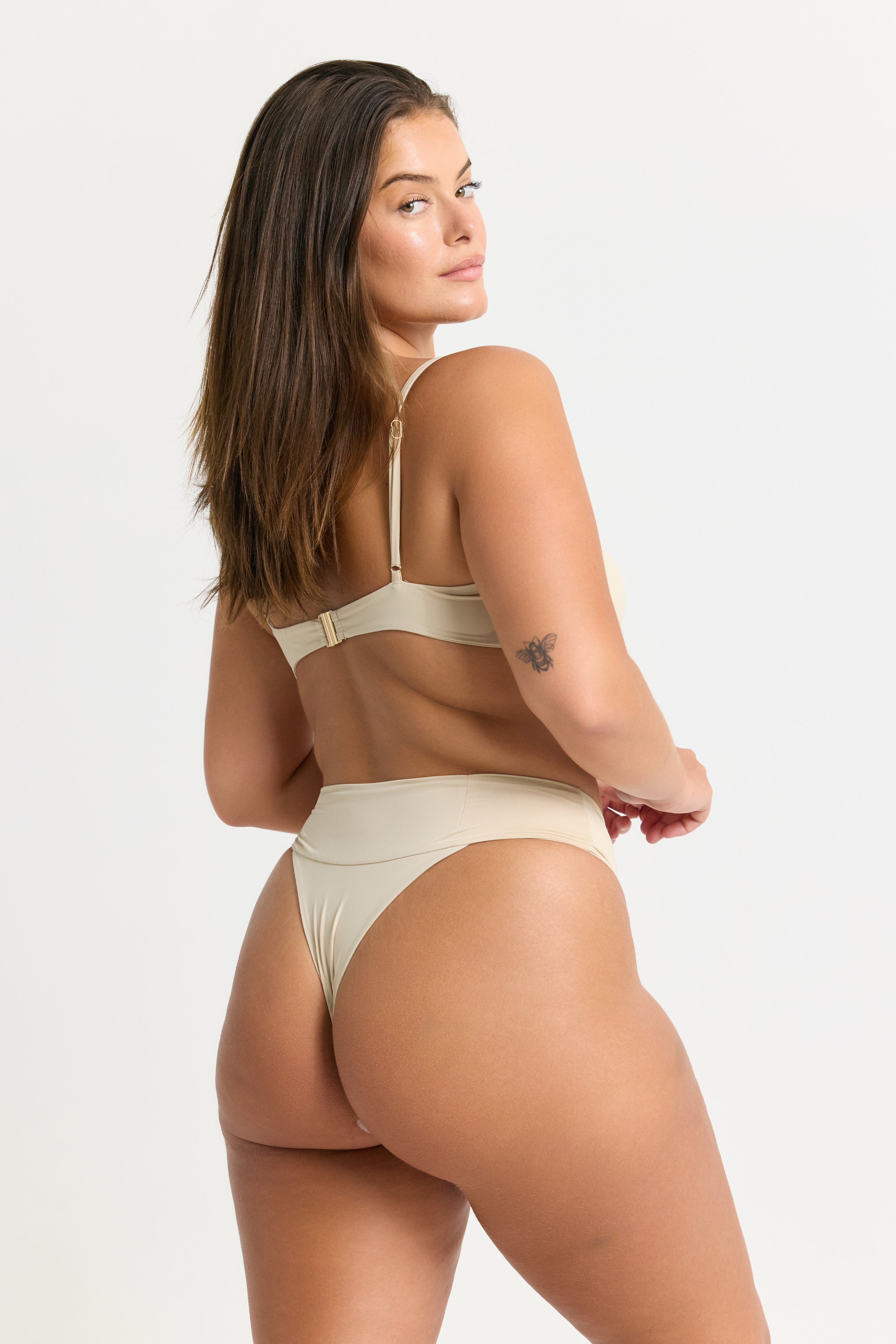 Woman wearing a coconut thong bikini bottom