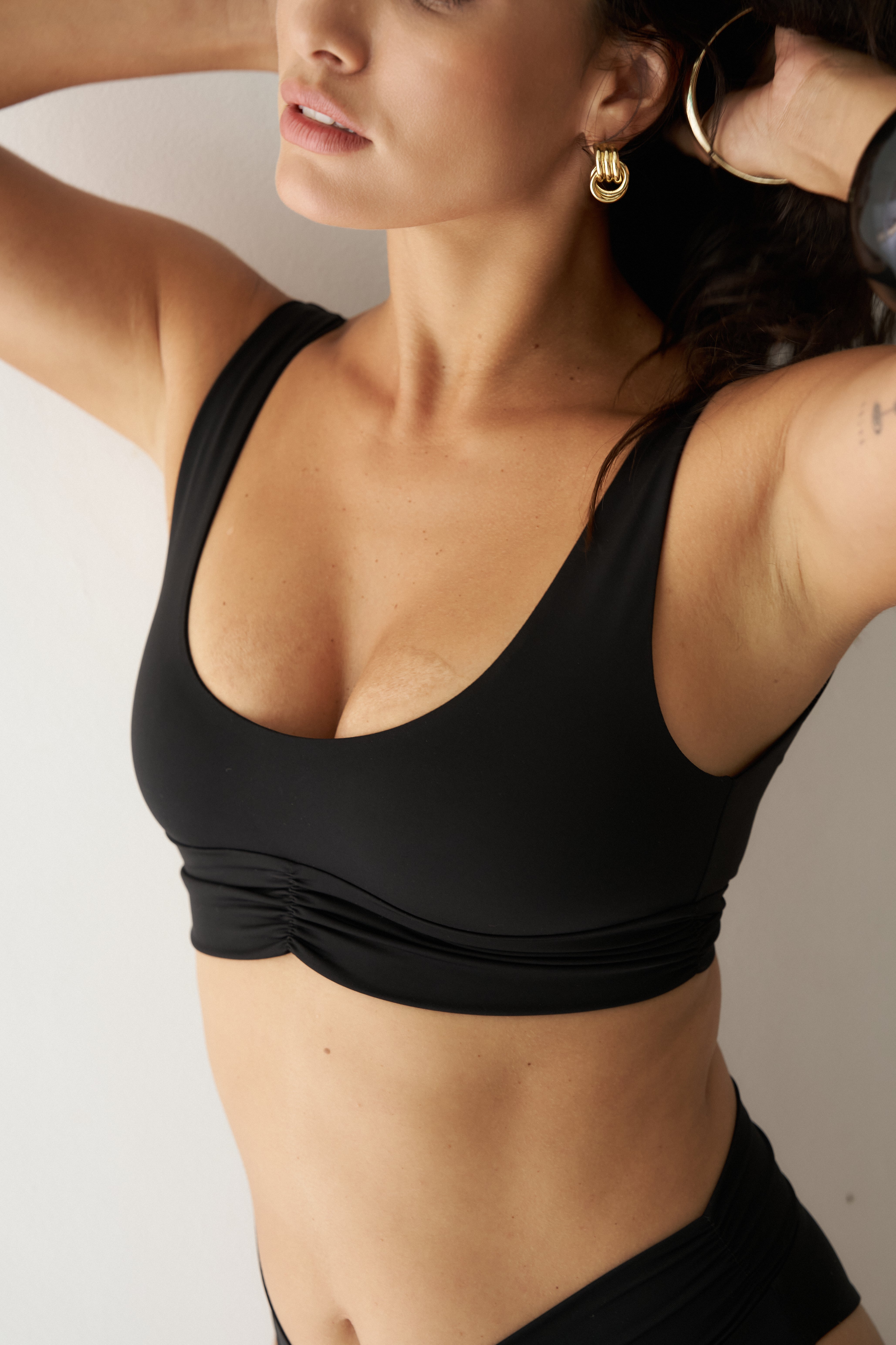 Black bikini top on model