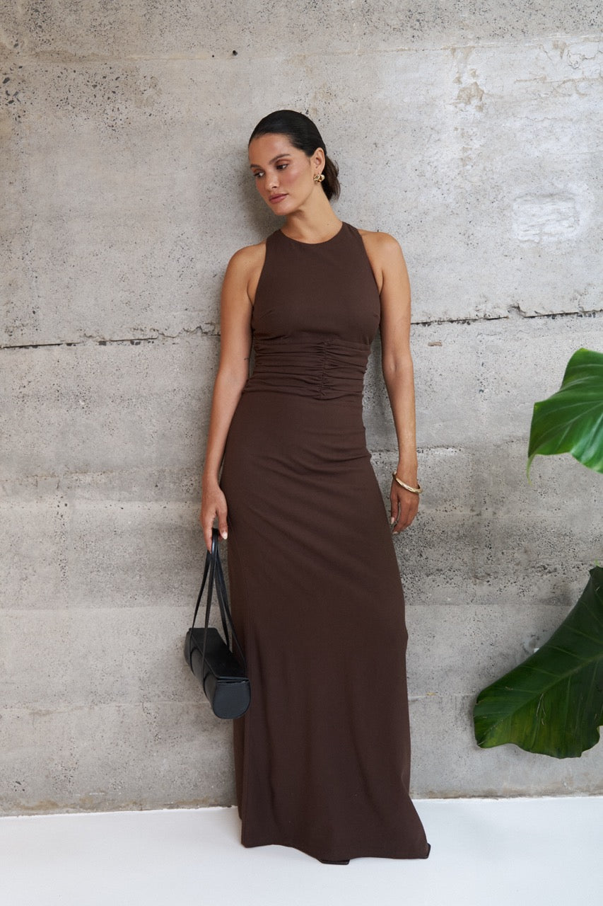 Riot Swim Rowen maxi dress in chocolate color, flowing fabric, sleeveless design, and ankle-length silhouette, perfect for summer wear.