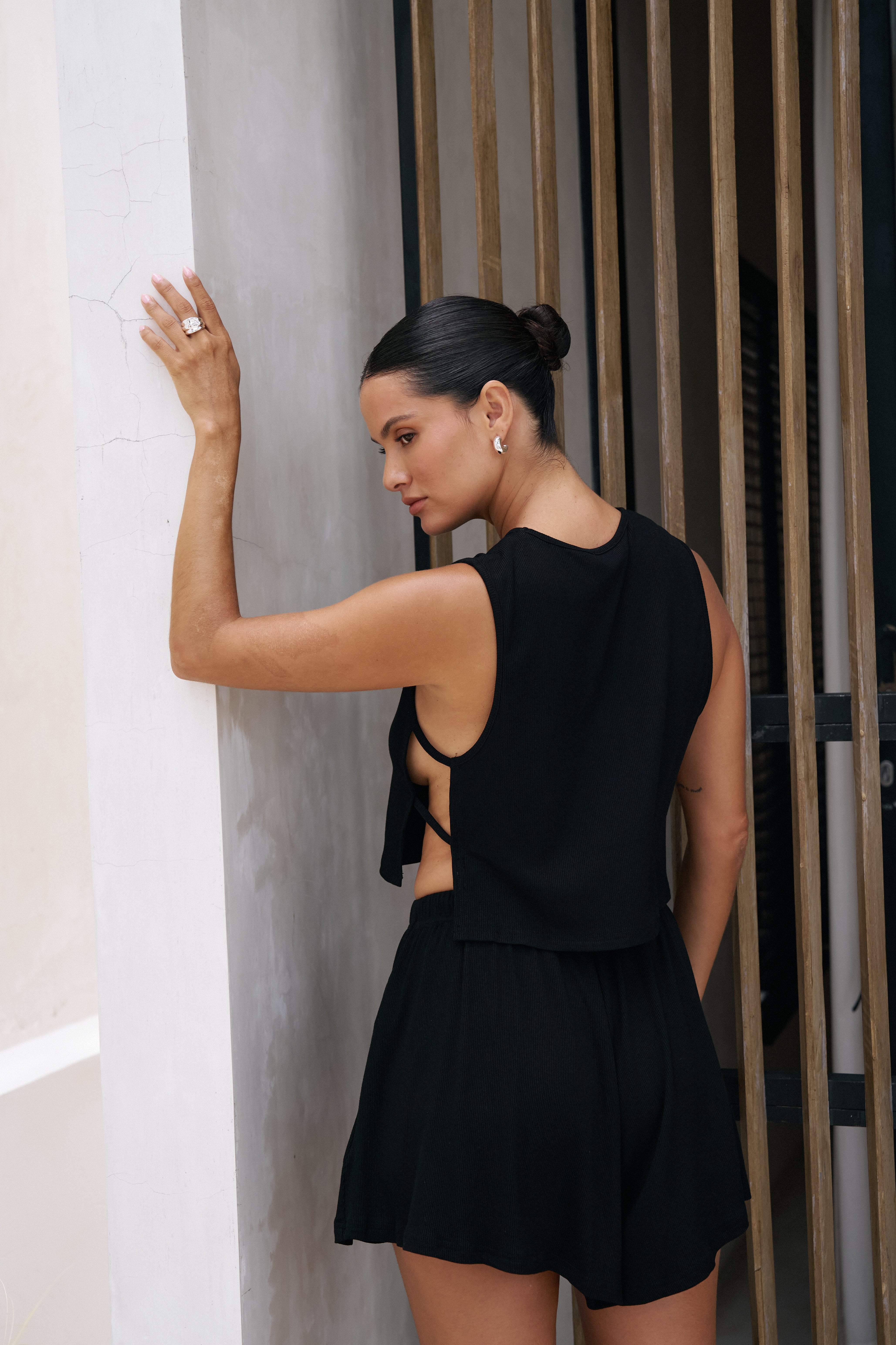 Riot Lounge Simi Side Strap Tank top in jet black, casual sleeveless women's top with side strap details.