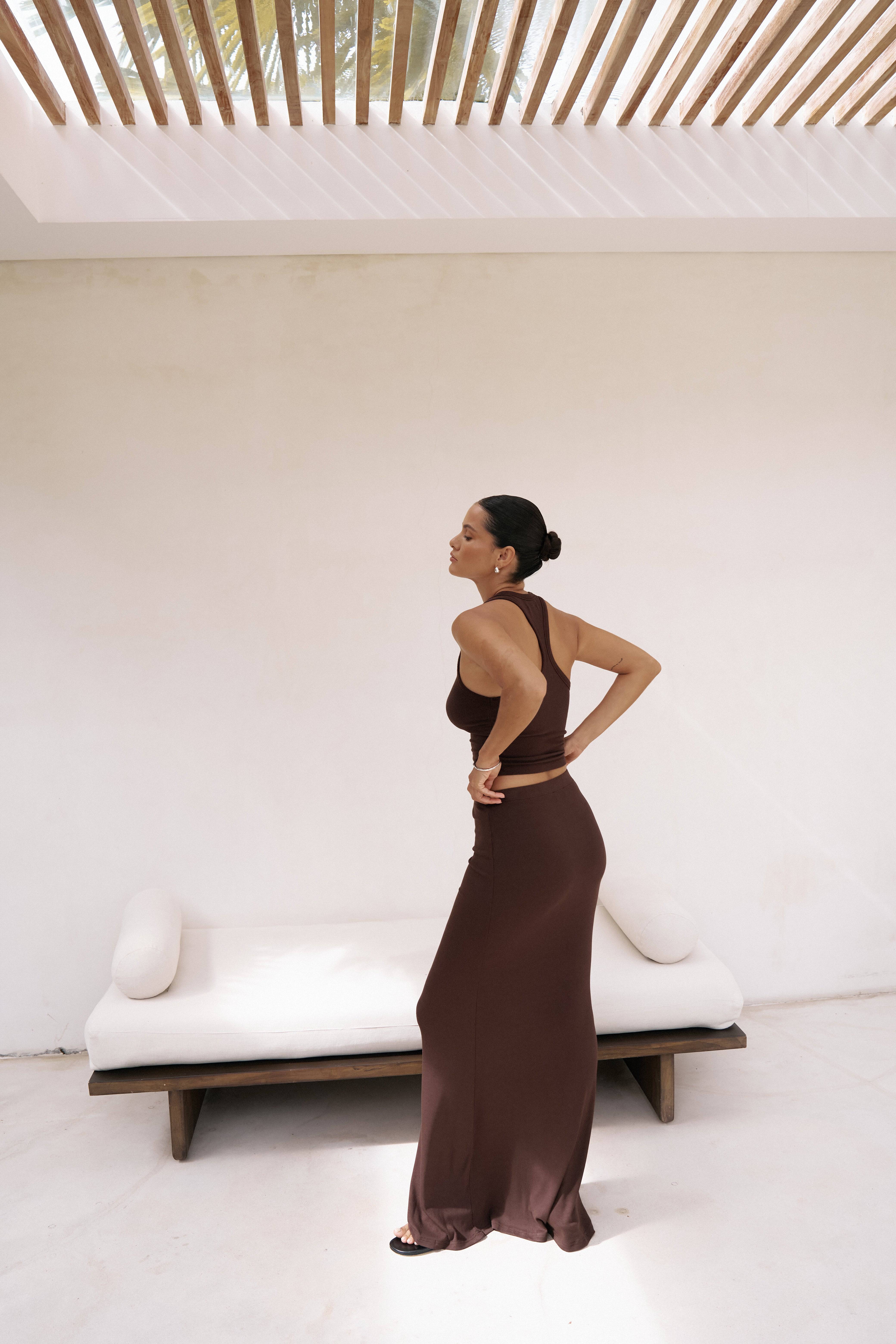 Back view of Riot Lounge Dom Maxi Skirt in chocolate, a stylish women's bottoms piece with a flowing, comfortable design.
