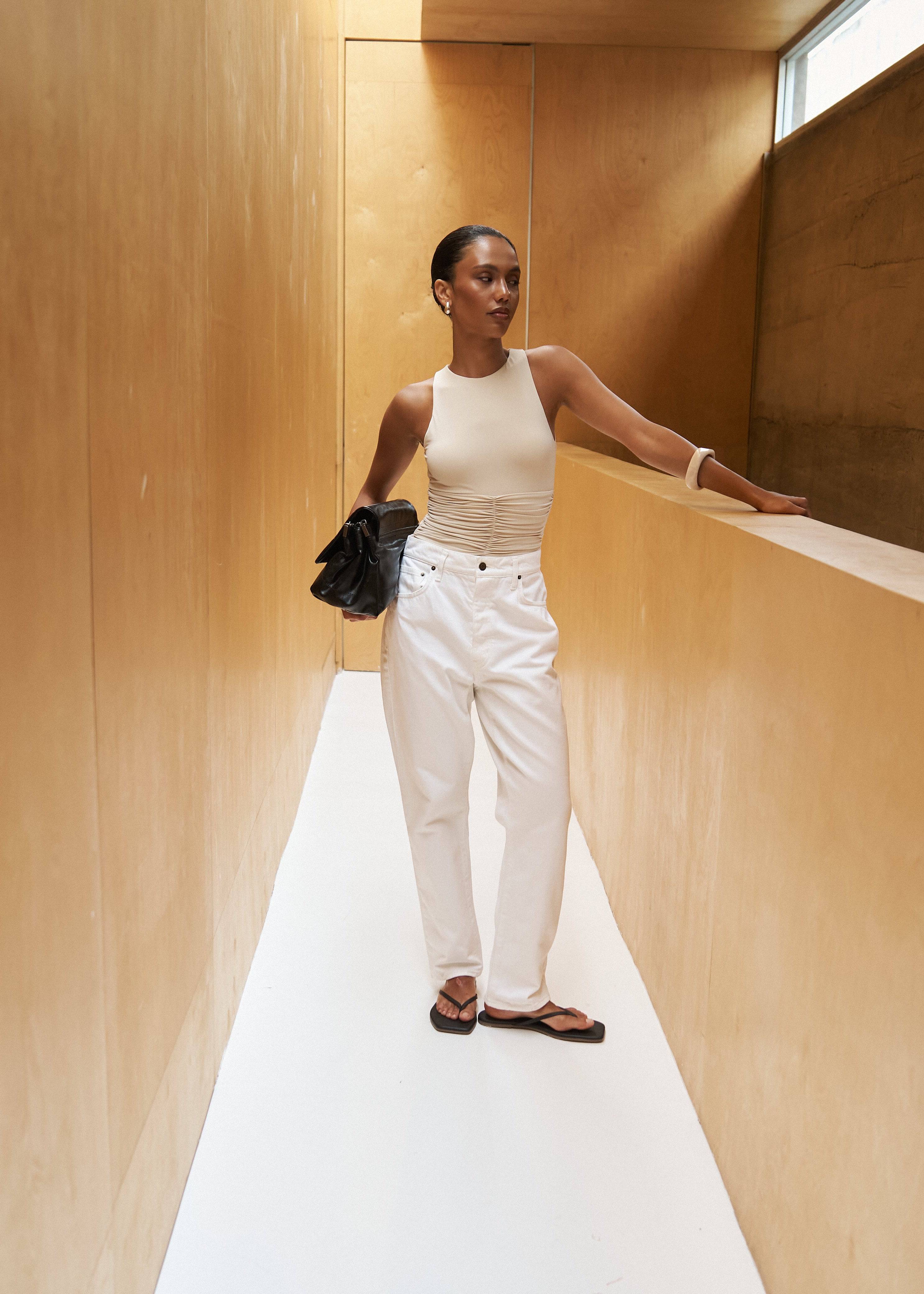 RIOT SWIM Jace Coconut one-piece swimsuit with moderate coverage, featuring a stylish tropical coconut print.