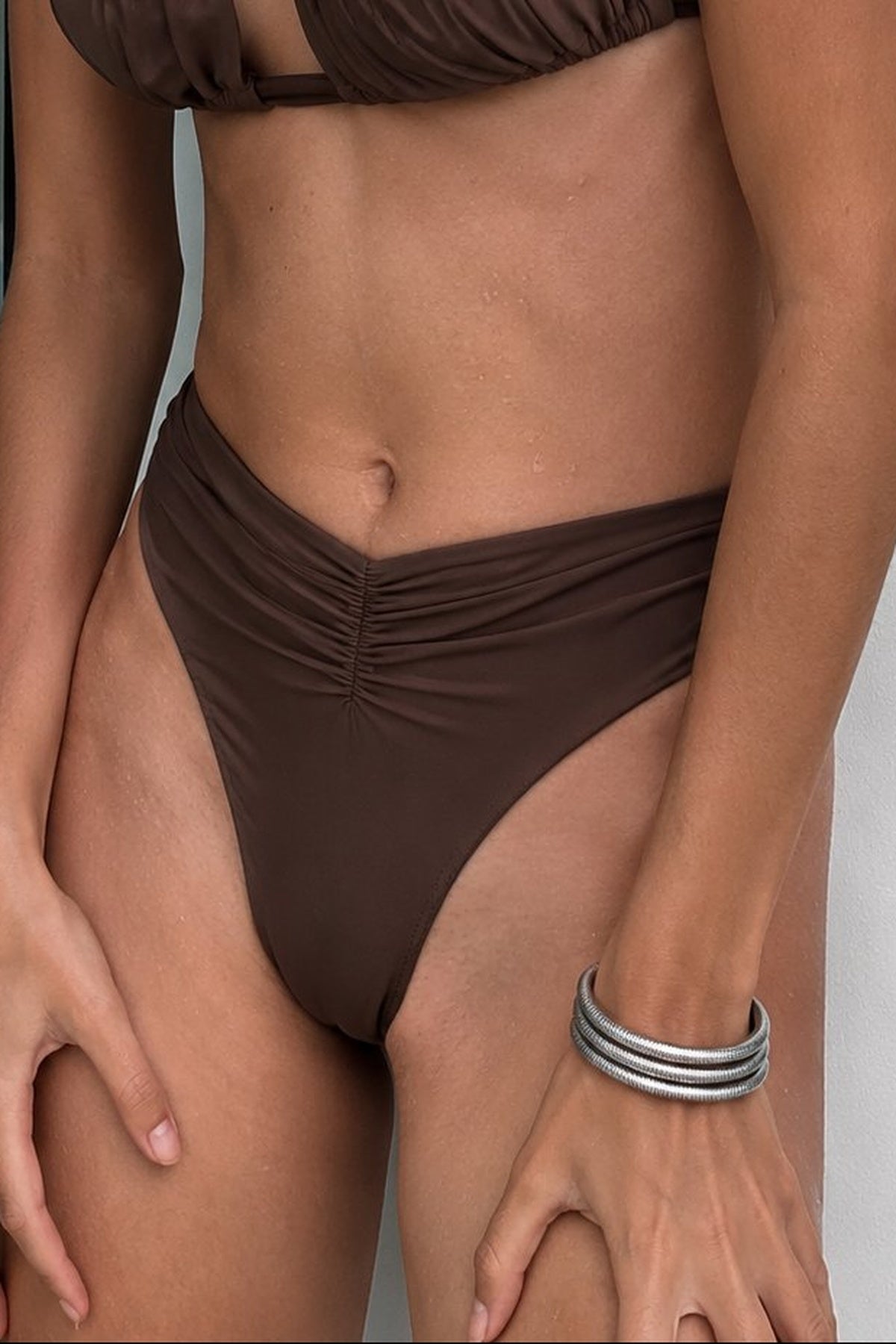 Riot Swim Margot Ruched Bottom in chocolate, showcasing a high-waisted bikini bottom with ruched detailing and smooth fabric.