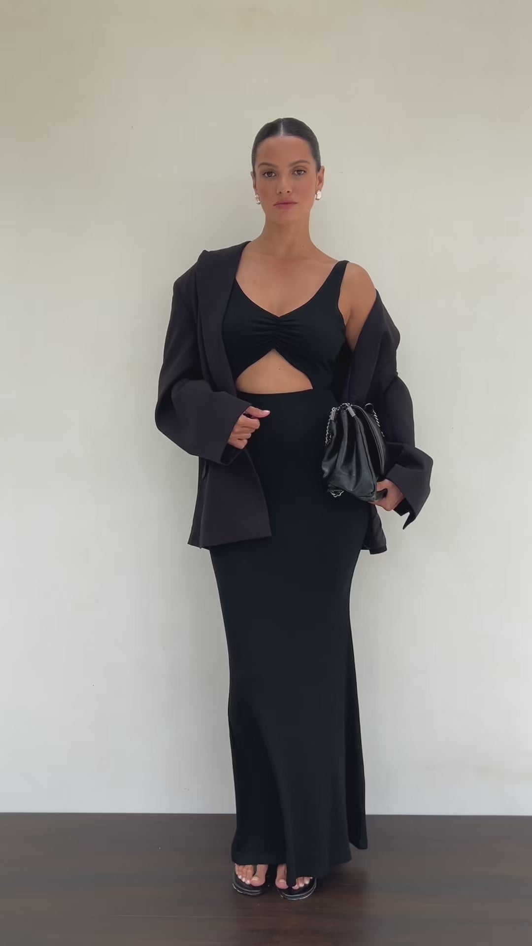 Model wearing Riot apparel in black.